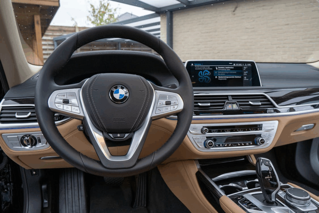 Modern car interior with digital dashboard and software-controlled features.