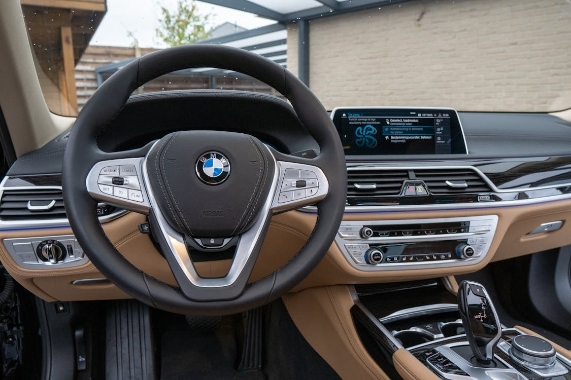 Modern car interior with digital dashboard and software-controlled features.