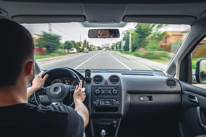 Driver using a simple car interior focused on comfort and everyday driving.