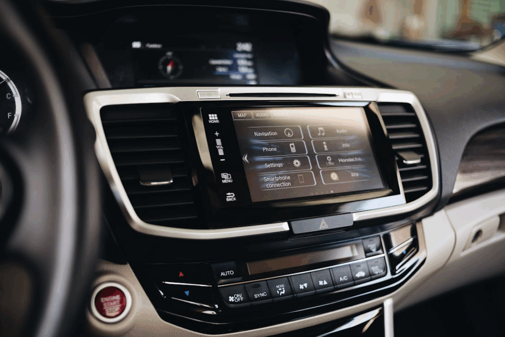 Car dashboard with touchscreen replacing traditional physical buttons.