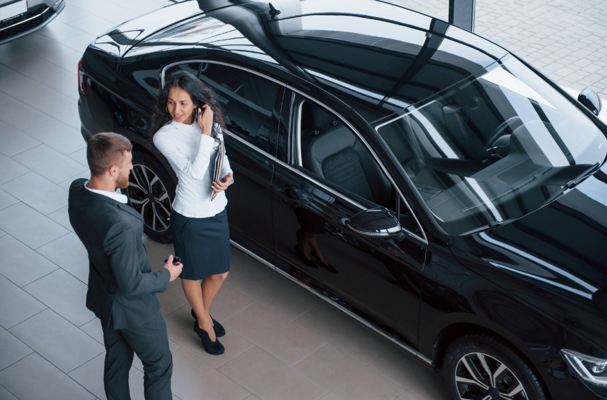 Buyers discussing vehicle pricing as entry-level cars become more expensive in 2026.